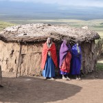 Maasai in front of their home